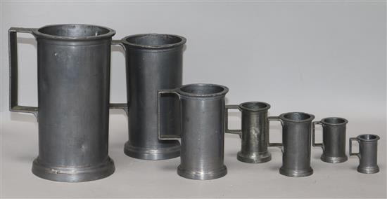 A set of seven French graduated pewter measures tallest 18cm